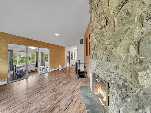461 Nome St, Aurora, CO 80010 - living area featuring wood finished floors, high vaulted ceiling, and a fireplace