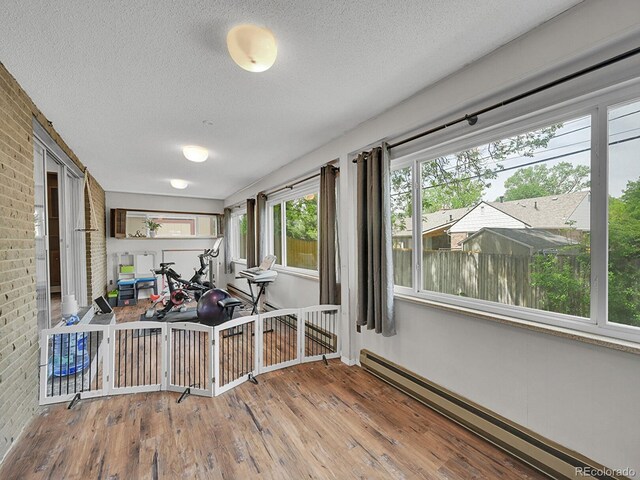 461 Nome St, Aurora, CO 80010 - sunroom / solarium featuring a baseboard heating unit