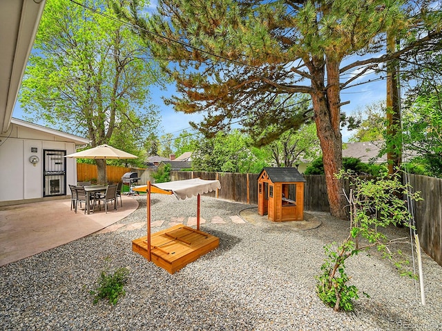 461 Nome St, Aurora, CO 80010 - view of patio / terrace with a fenced backyard and an outdoor structure