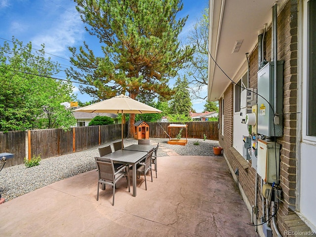 461 Nome St, Aurora, CO 80010 - view of patio with outdoor dining area and a fenced backyard