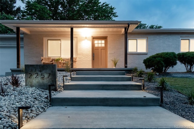 2257 S Lowell Blvd, Denver, CO 80219 - view of front of property with a porch and brick siding