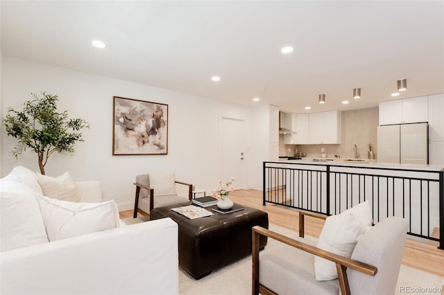 2257 S Lowell Blvd, Denver, CO 80219 - living room featuring light wood-style floors and recessed lighting