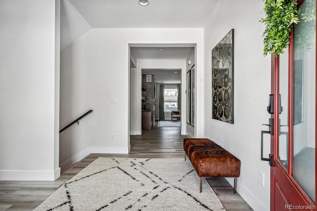 corridor with dark hardwood / wood-style floors