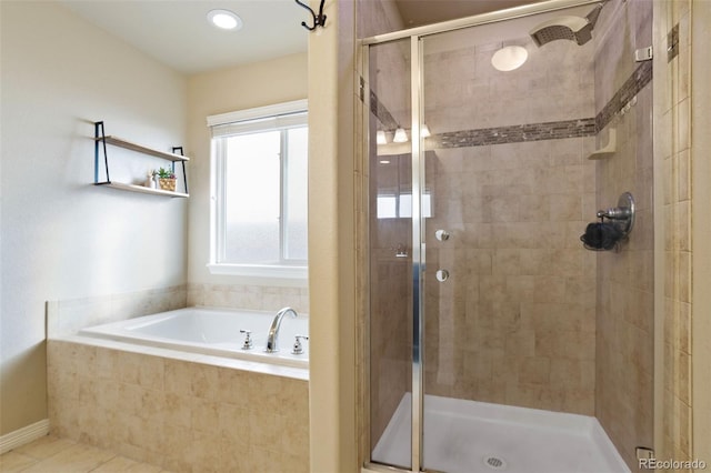 bathroom with tile patterned floors and plus walk in shower