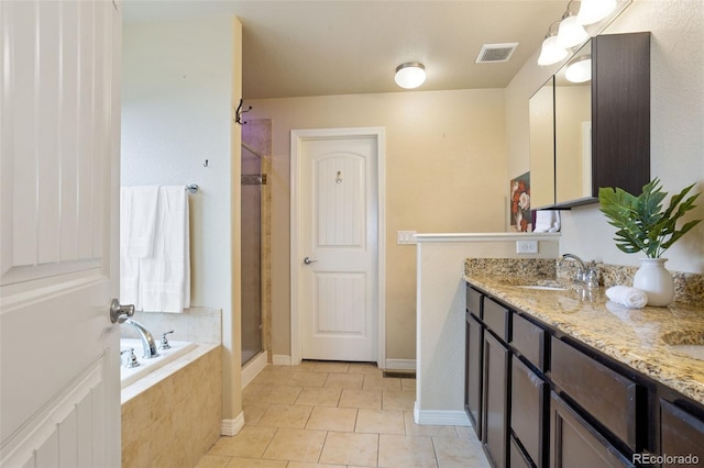 bathroom featuring separate shower and tub, tile patterned floors, and vanity