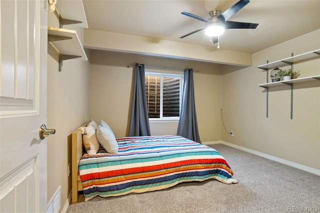 bedroom featuring ceiling fan and carpet