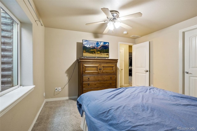 bedroom with ceiling fan and light colored carpet