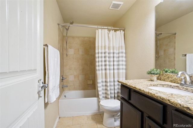 full bathroom with tile patterned floors, vanity, shower / tub combo, and toilet