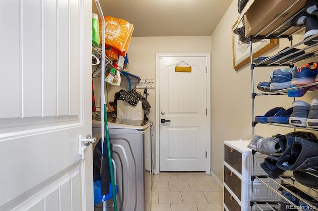 washroom featuring light tile patterned floors and washer / clothes dryer