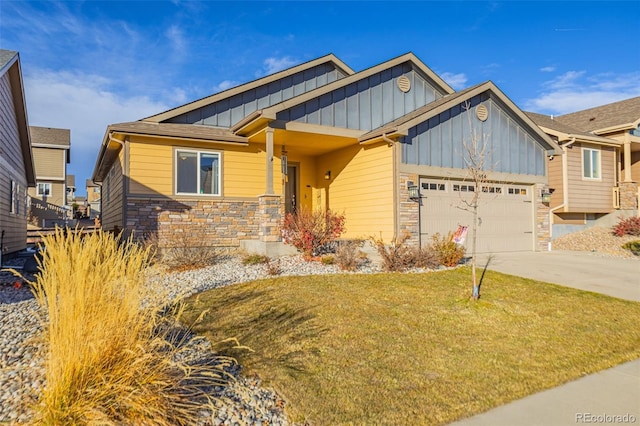 craftsman-style home with a front lawn and a garage