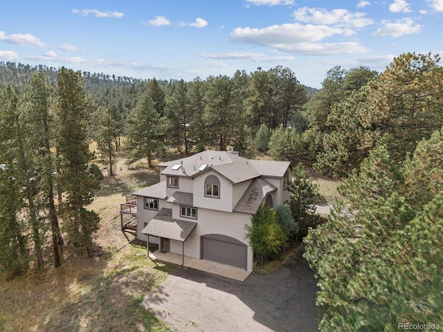 bird's eye view featuring a forest view