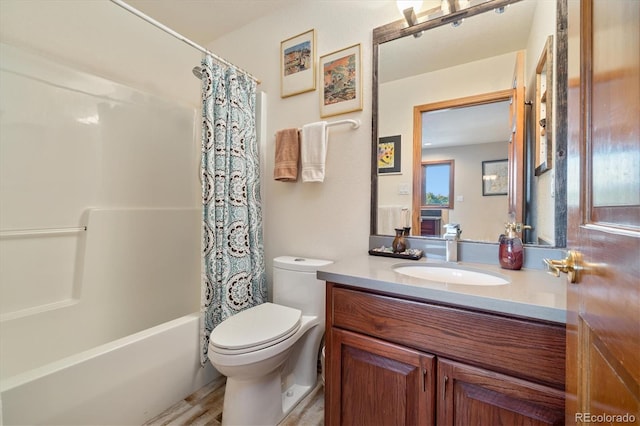 bathroom with toilet, shower / bath combination with curtain, and vanity