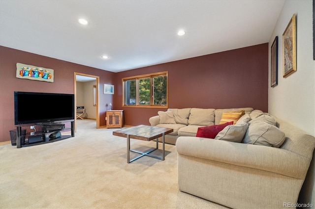 living area featuring light carpet, baseboards, and recessed lighting