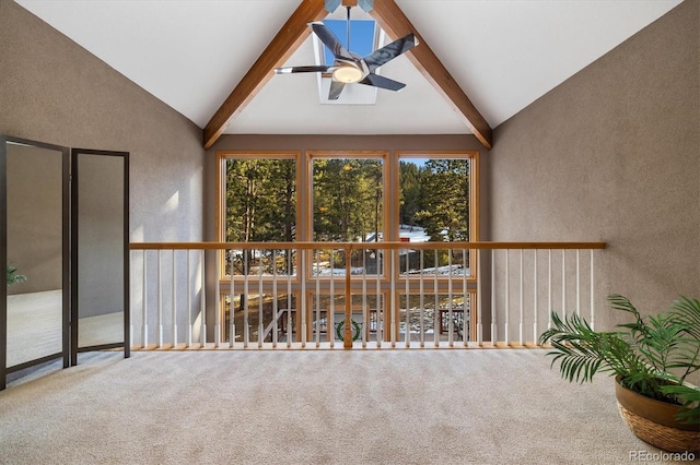 unfurnished sunroom with lofted ceiling with beams and ceiling fan