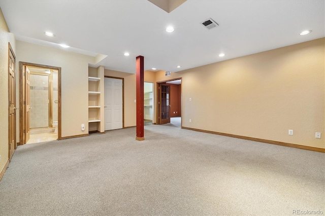 interior space featuring baseboards, recessed lighting, visible vents, and light colored carpet