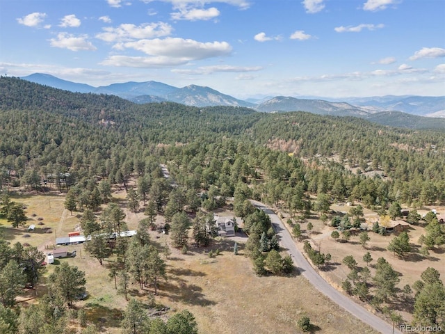 bird's eye view featuring a mountain view and a view of trees