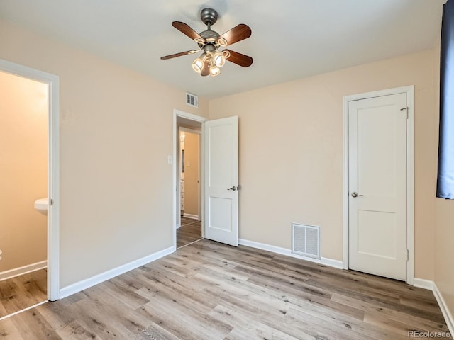 unfurnished bedroom with ceiling fan and light hardwood / wood-style flooring