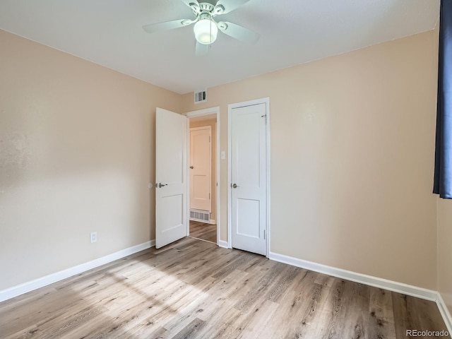 unfurnished bedroom with light wood-type flooring and ceiling fan