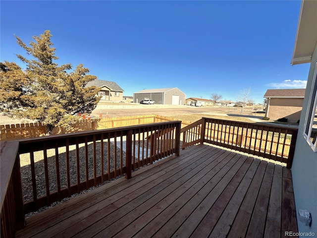 wooden deck featuring a fenced backyard and a residential view