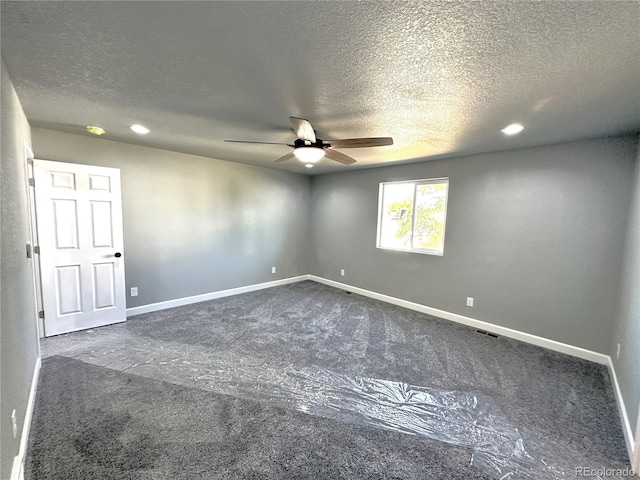 carpeted spare room featuring a textured ceiling, recessed lighting, visible vents, a ceiling fan, and baseboards