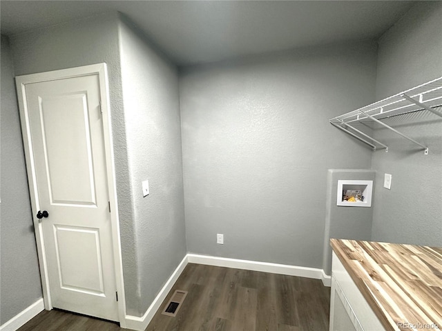 washroom with dark wood-style floors, laundry area, hookup for a washing machine, and baseboards