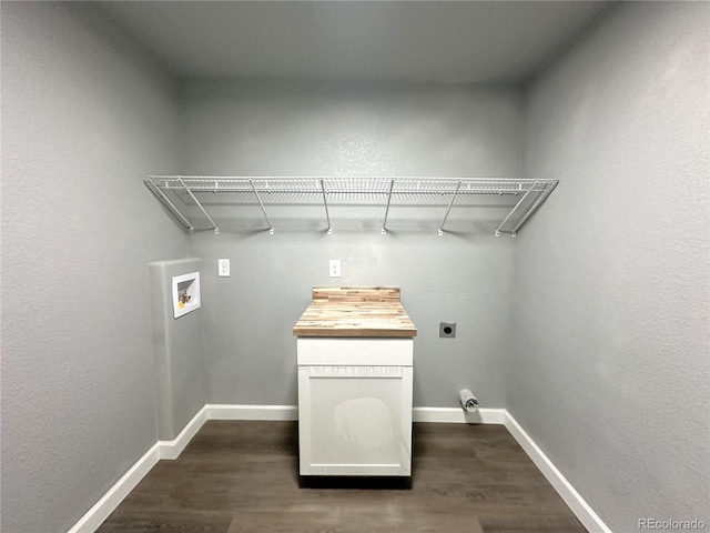 clothes washing area with baseboards, washer hookup, dark wood-type flooring, and electric dryer hookup