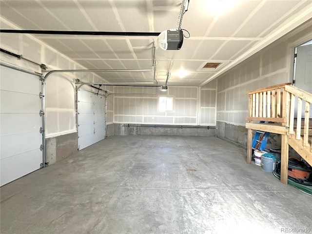 garage featuring a garage door opener