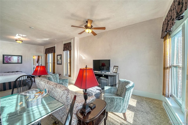 carpeted living room featuring ceiling fan