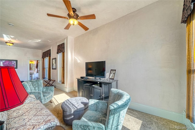 living room featuring light carpet and ceiling fan