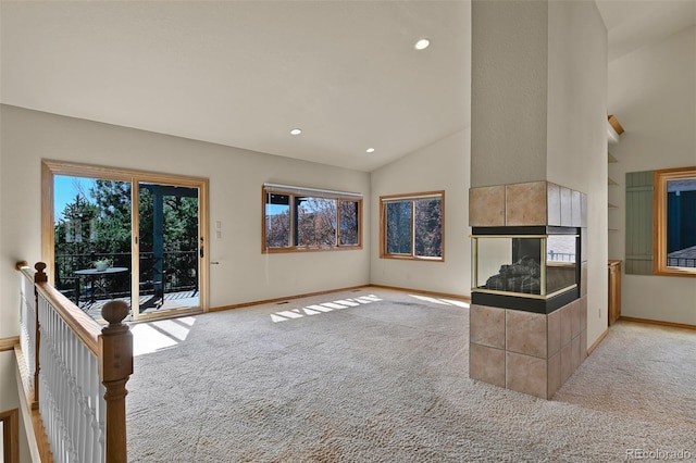 5130 Sevenoaks Dr, Colorado Springs, CO 80919 - unfurnished living room featuring carpet floors, high vaulted ceiling, baseboards, and a fireplace