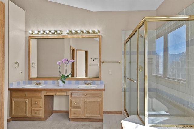 5130 Sevenoaks Dr, Colorado Springs, CO 80919 - full bathroom with double vanity, a sink, and a stall shower