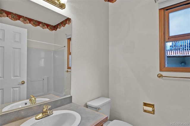 5130 Sevenoaks Dr, Colorado Springs, CO 80919 - full bathroom featuring a shower, toilet, and vanity