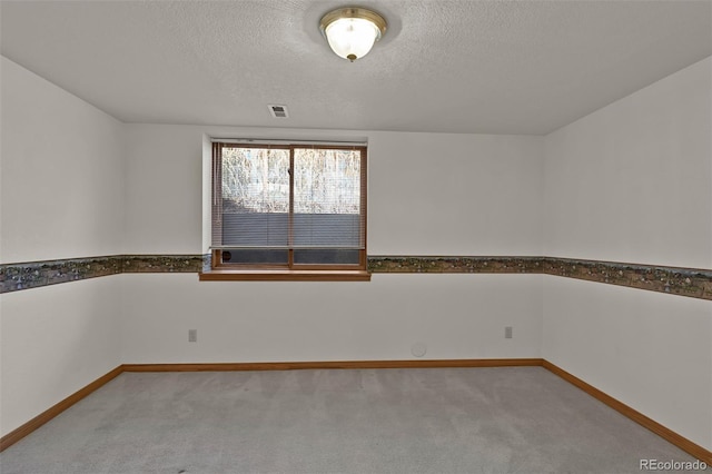 5130 Sevenoaks Dr, Colorado Springs, CO 80919 - empty room featuring baseboards, a textured ceiling, visible vents, and carpet
