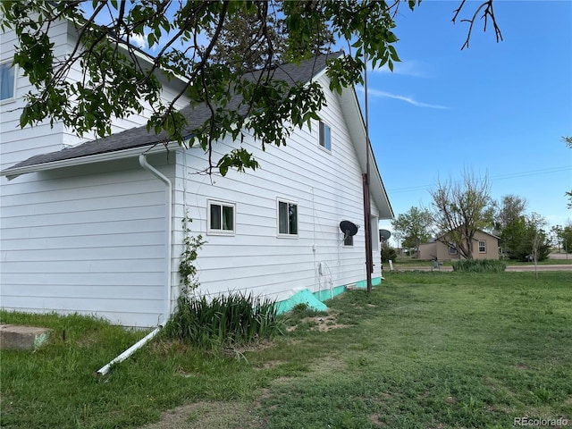 117 Lincoln Ave, Arriba, CO 80804 - view of property exterior with a lawn and roof with shingles