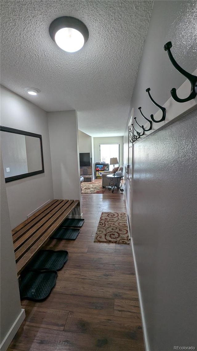 2710 Ryan Gulch Rd Unit 2731, Silverthorne, CO 80498 - hallway featuring wood finished floors and a textured ceiling