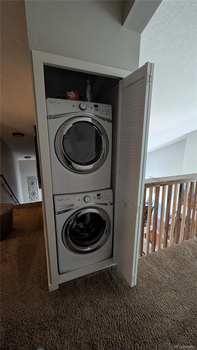 2710 Ryan Gulch Rd Unit 2731, Silverthorne, CO 80498 - laundry area with stacked washer / drying machine and carpet