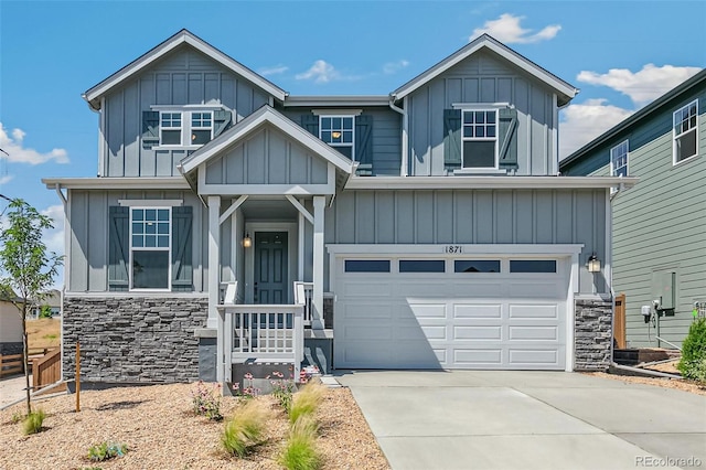 craftsman-style house featuring stone siding, board and batten siding, driveway, and a garage