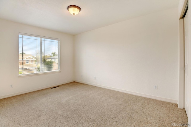 unfurnished room featuring carpet flooring