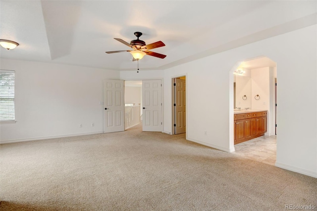 interior space with ceiling fan