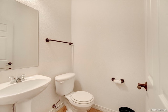 bathroom with toilet and sink