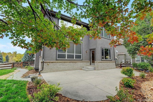 rear view of property featuring a patio