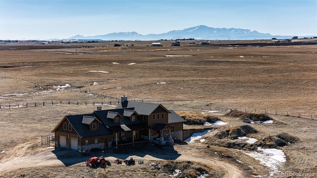 drone / aerial view featuring a rural view and a mountain view