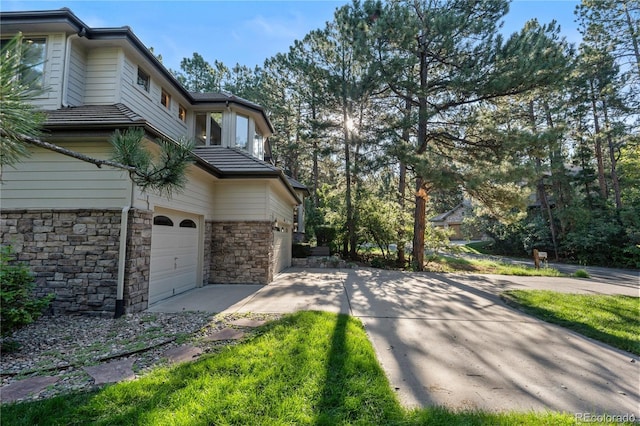 view of side of property with a garage