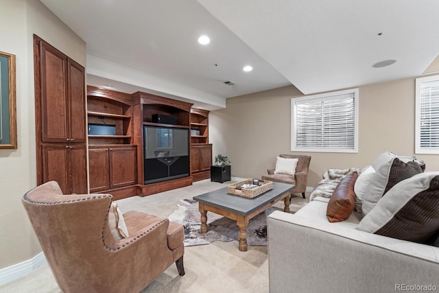 living room featuring light colored carpet