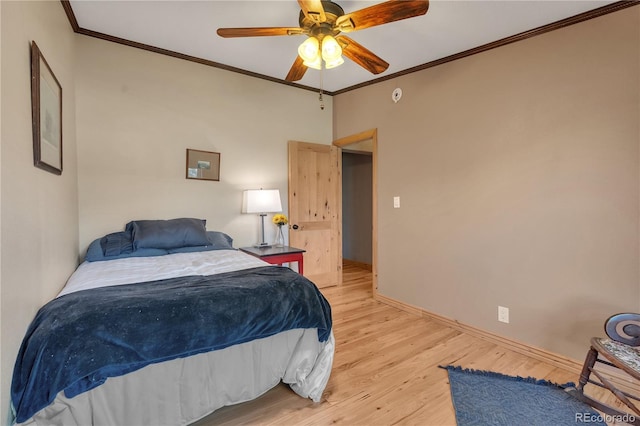 bedroom featuring light wood-type flooring, crown molding, baseboards, and ceiling fan