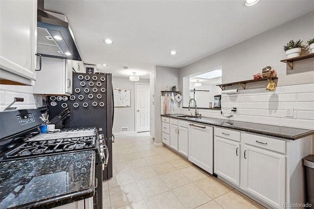 kitchen featuring open shelves, white dishwasher, a sink, range with gas cooktop, and backsplash