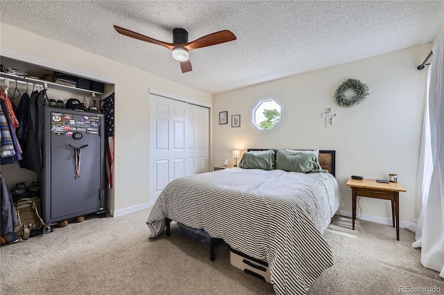 12131 Melody Dr Unit 201, Denver, CO 80234 - carpeted bedroom featuring a ceiling fan, a textured ceiling, and multiple closets