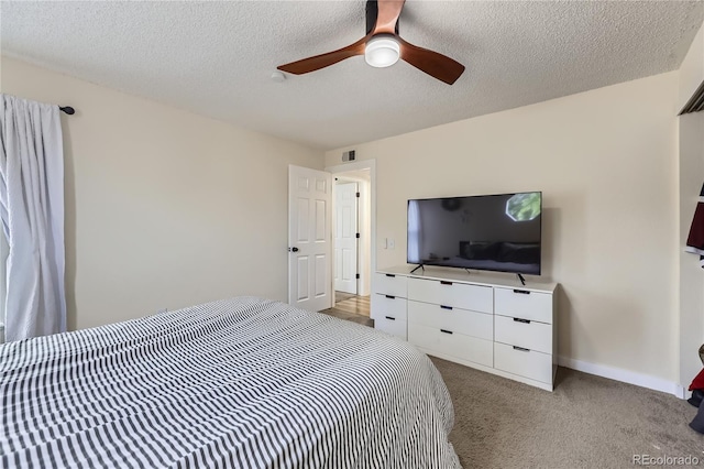 12131 Melody Dr Unit 201, Denver, CO 80234 - bedroom featuring a textured ceiling, carpet, and ceiling fan