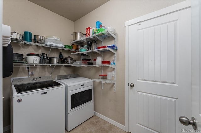 8110 Somersby Pl, Colorado Springs, CO 80908 - laundry room featuring washer and clothes dryer, baseboards, and light tile patterned flooring