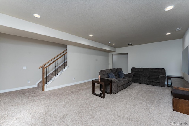 8110 Somersby Pl, Colorado Springs, CO 80908 - carpeted living room with baseboards, recessed lighting, stairs, and a textured ceiling